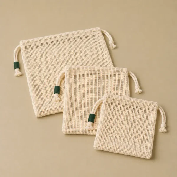 Lot de sacs à vrac réutilisables Eco Action en textile naturel.